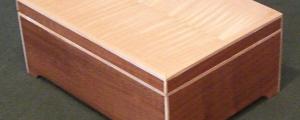 Box out of cherry with maple accents, and flame maple veneer top