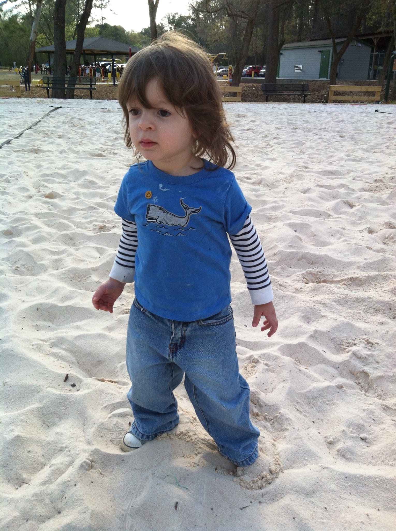 Lucas at 2, playing in the volleyball court sand
