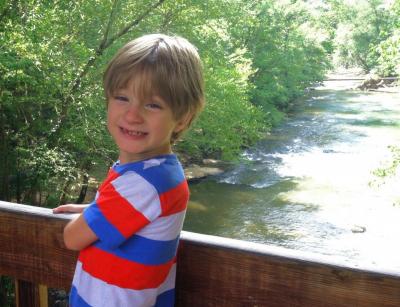 Liam on a bridge over Big Creek, in Roswell near our house