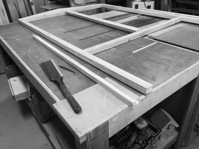 Front wall frame laid out in prepartion to fit a door jamb. I cut the L-shaped jamb pieces on the table saw, then cut them to fit with the ryoba.