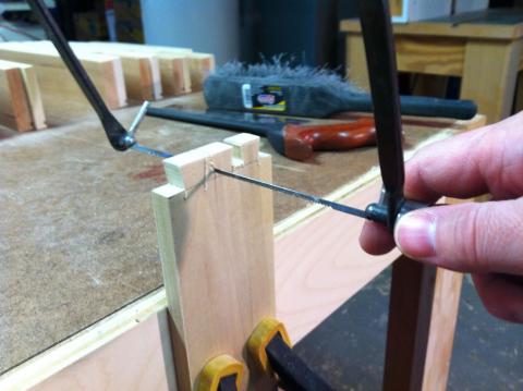 Clearing between dovetails with a coping saw